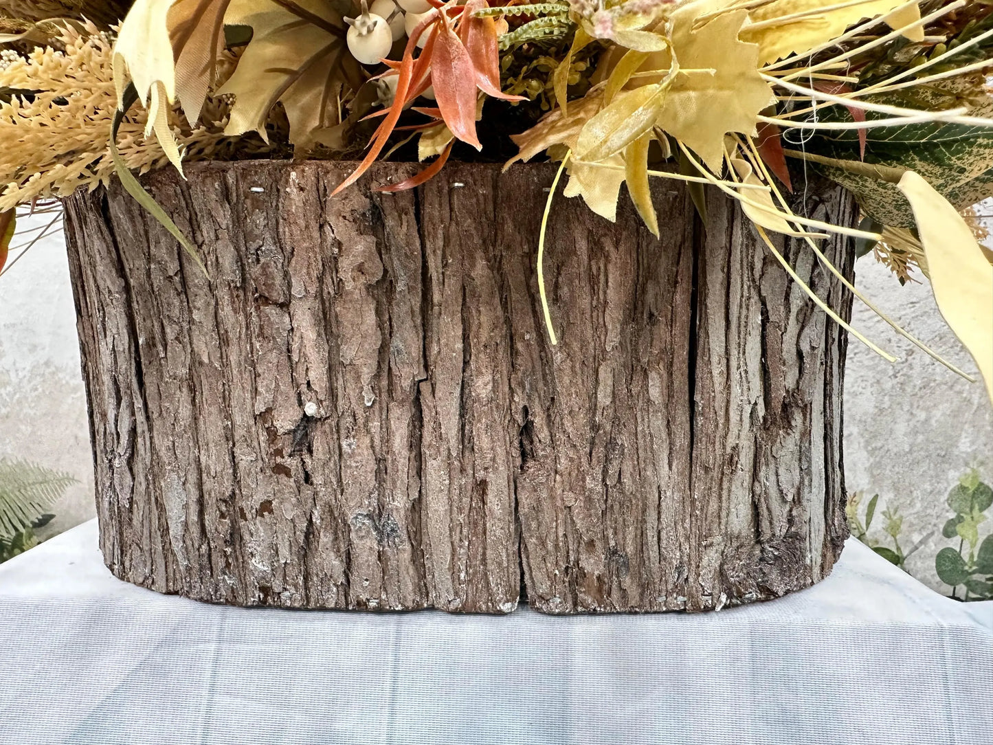 FALL CENTERPIECE IN LOG CONTAINER