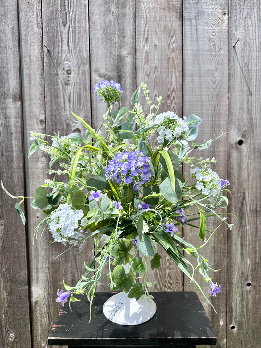WHITE AND LAVENDER CANDLESTICK CENTERPIECE