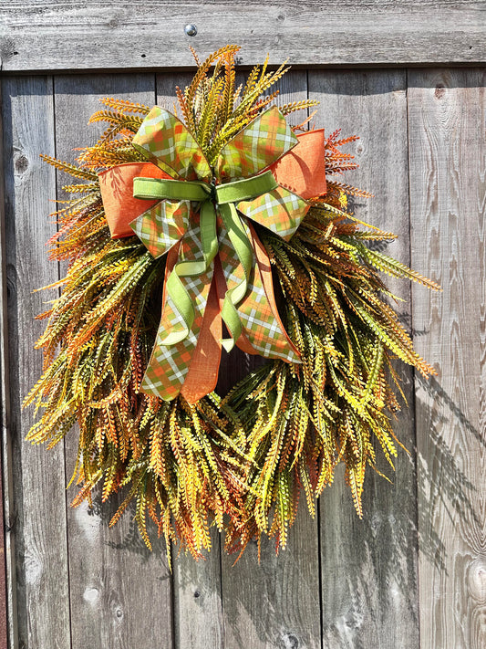 ORANGE BEAD GRASS WITH ORANGE AND GREEN RIBBON